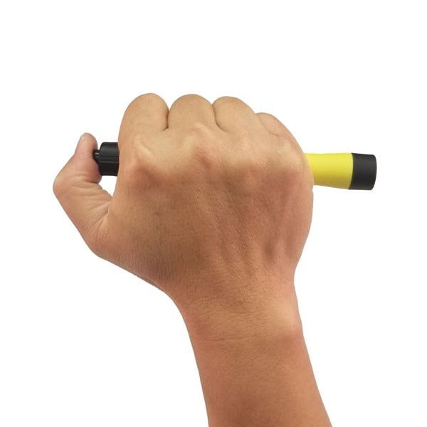 A hand holding the Nightstick XPP-5411GX Intrinsically Safe Penlight w/Mount, featuring yellow and black colors, against a plain white background.