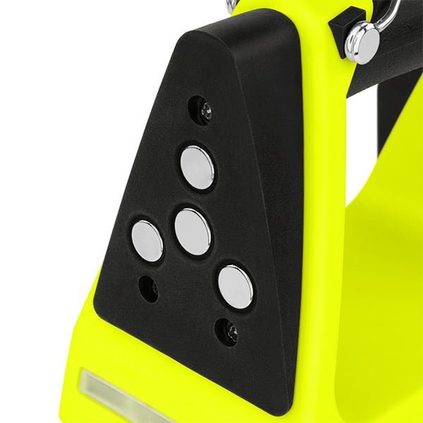 Close-up of the Nightstick XPR-5584GMX INTEGRITAS™ Intrinsically Safe Rechargeable Lantern with Magnetic Base in black and neon yellow, featuring four round silver buttons arranged in a triangle on a slanted surface.