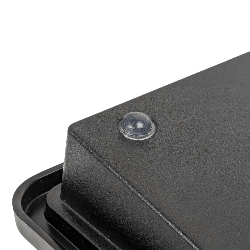 Close-up of the Armadex BT-Key-02 ATEX Intrinsically Safe Keyboard, a rugged Bluetooth device featuring a clear rubber bumper on the corner, displayed against a plain white background.