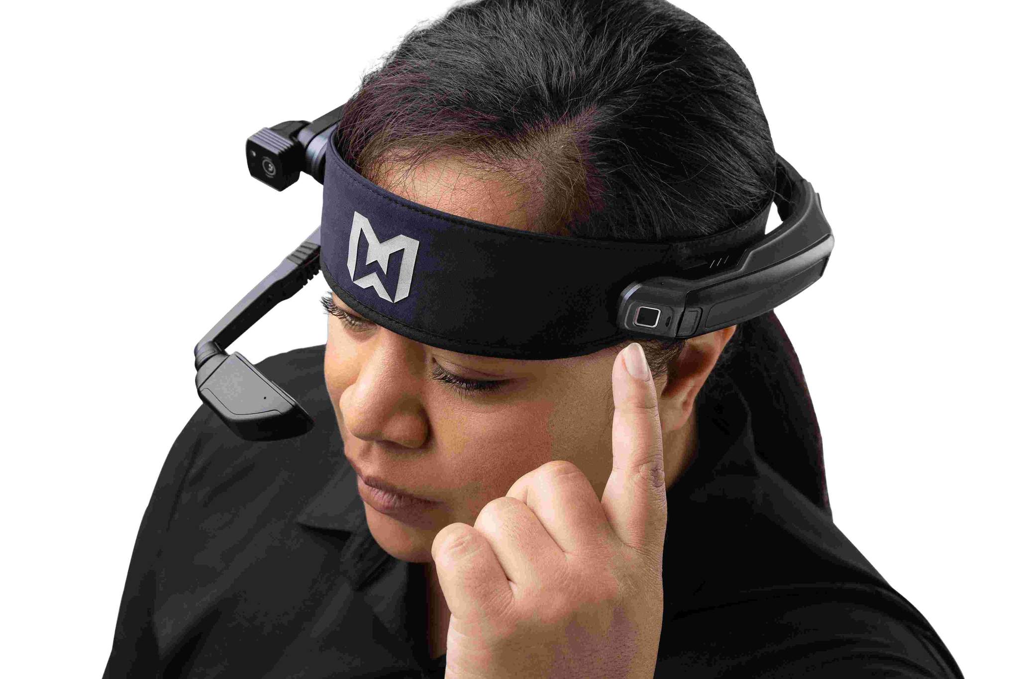A person wearing a black headband is using the RealWear Navigator™ 500 Rugged Handsfree Tablet with noise cancellation, touching the side of the headset.
