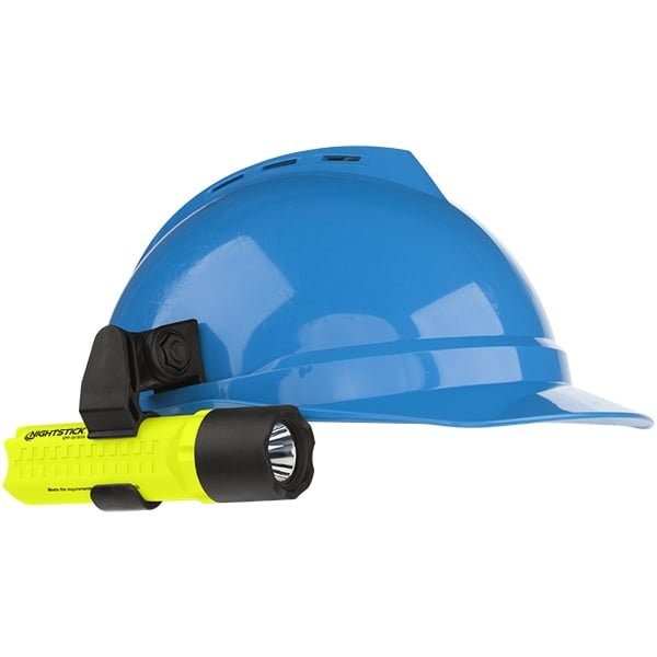 A blue hard hat with a Nightstick XPP-5418GX-K01 Intrinsically Safe Flashlight featuring advanced LED technology and a multi-angle mount attached to the side.
