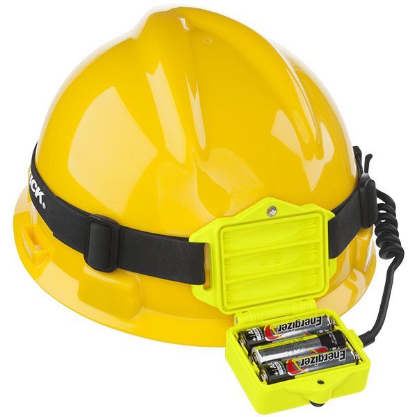 A yellow hard hat holds a Nightstick XPP-5462GX DICATA™ Intrinsically Safe Low-Profile Dual-Light™ Headlamp; its battery pack is open, showing two AA Energizer batteries inside.