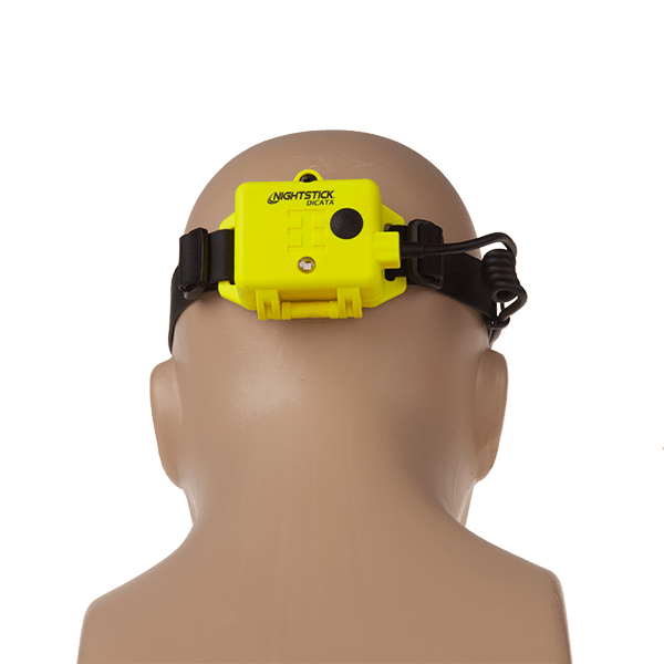 A mannequin head shown from the back is wearing the Nightstick XPP-5462GX DICATA™ Intrinsically Safe Low-Profile Dual-Light™ Headlamp, a yellow fire helmet headlamp with a black strap.