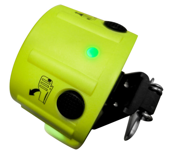 A close-up of the yellow Nightstick XPP-5564GXA INTRANT® DUO IS Dual-Light Angle Light (Zone 0/20), featuring a glowing green indicator, control buttons, a black mounting bracket, and a printed hand symbol on the device.