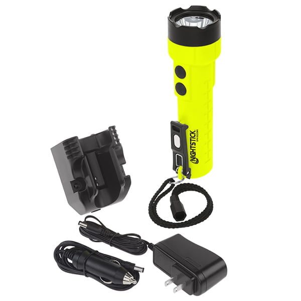 The Nightstick XPR-5522GMX Intrinsically Safe Rechargeable Dual-Light™ Flashlight features a yellow body, dual black buttons, lanyard, charging dock, and includes both a wall outlet and car charging cable.