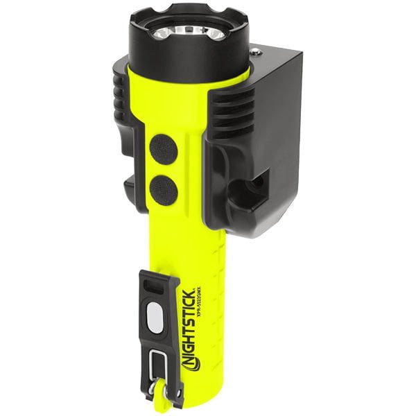 A yellow and black Nightstick XPR-5522GMX Intrinsically Safe Rechargeable Dual-Light™ Flashlight with dual magnets is shown mounted in a black charging cradle.