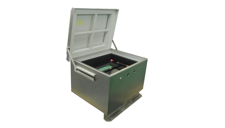 The Extronics iBATT5xx is a stainless-steel universal battery enclosure with a hinged lid, designed for hazardous Zone 1 and 2 areas and ATEX certified, showing internal components and wiring inside.