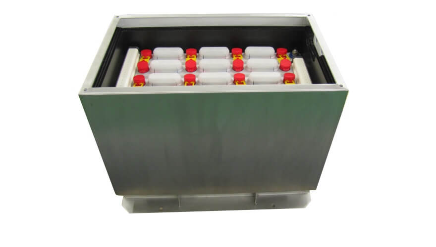 The Extronics iBATT5xx Zone 1 and 2 Stainless-Steel Universal Battery Enclosure securely holds multiple white plastic canisters with red caps in rows; it's ATEX certified for IECEx Zone 1, making it ideal for hazardous environments.