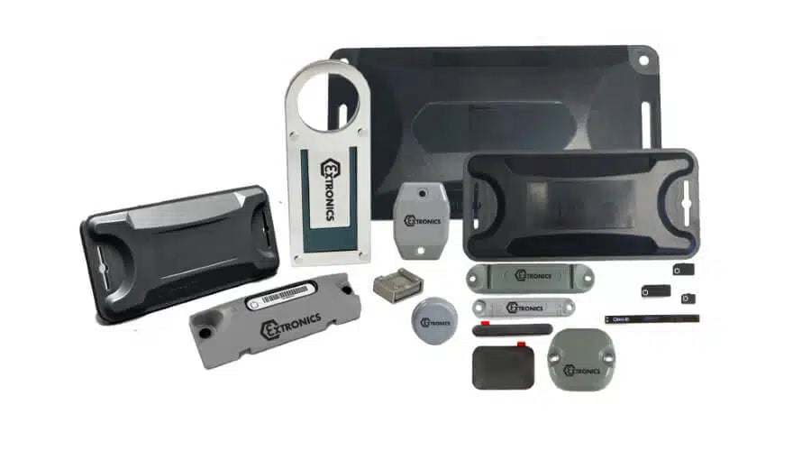 Extronics iTAG500 Intrinsically Safe Passive UHF RFID tags in black, gray, and silver, including rugged construction and long-range options in various shapes and sizes, are arranged on a white background.