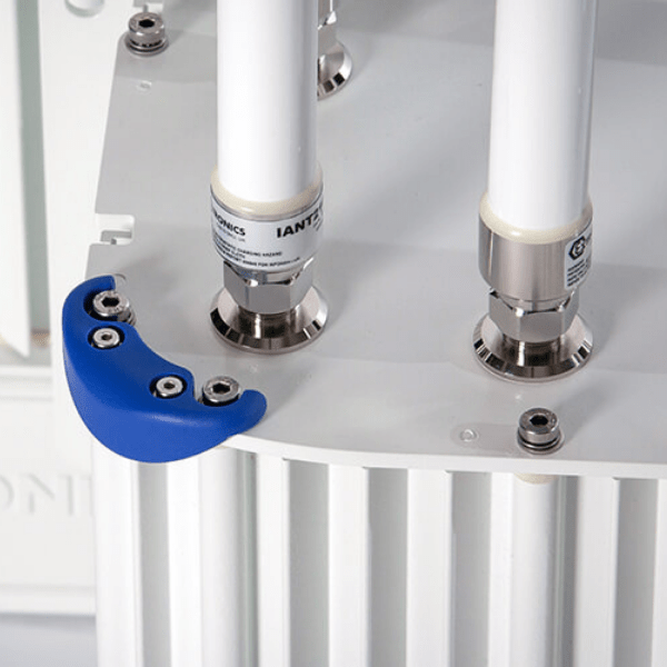 Close-up of three white cylindrical antennas with metal connectors and a blue cover on the Extronics iWAP XN3 Zone 2/Division 2 Universal Wireless Enclosure System—ideal for wireless technology applications.