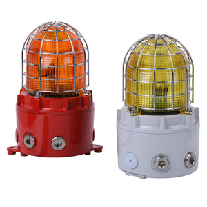 Two E2S D1xB2LD2 explosion-proof LED beacons with stainless steel guards: one has an orange UV-stable lens on a red base, the other a yellow UV-stable lens on a white base.