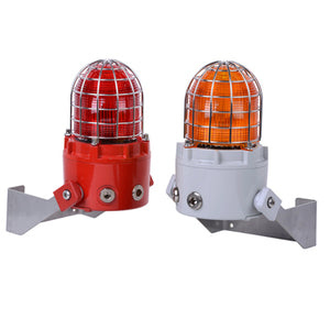 Two E2S D1xB2LD2 Explosion Proof LED Multi-function Beacons with stainless steel guards, one red and one orange, have UV stable lenses and are mounted on metal brackets against a white background.