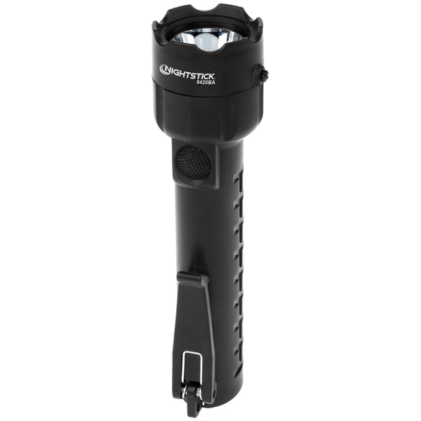 A Nightstick XPP-5420B [UL-913] IS Permissible black handheld LED flashlight with a base clip stands upright on a white background.