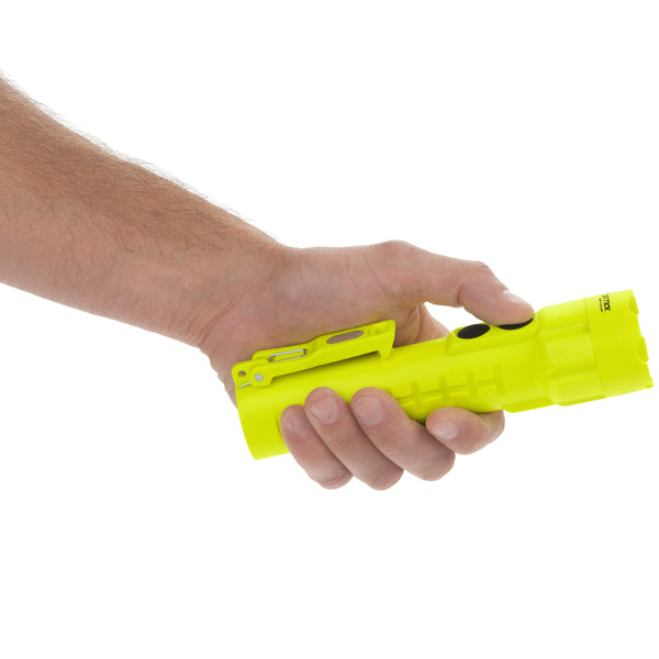 A hand holding a Nightstick XPP-5422GMA [Zone 0] IS Dual-Light Flashlight w/Dual Magnets with a side clip, set against a white background.
