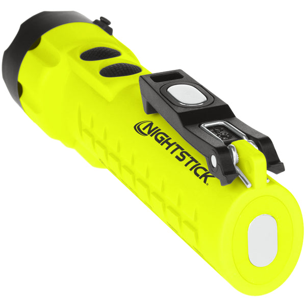 A bright yellow Nightstick XPP-5422GMXA [Zone 0] IS Dual-Light Torch w/Dual Magnets lies on its side, featuring black buttons, a metal clip, and a round lens at one end.