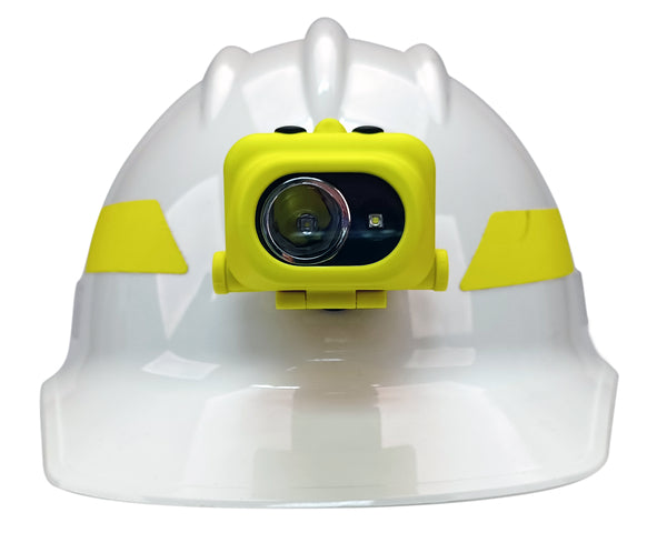 A white hard hat with yellow stripes features a mounted Nightstick XPP-5454GC [Zone 0] IS Dual-Light Headlamp with kit on the front.