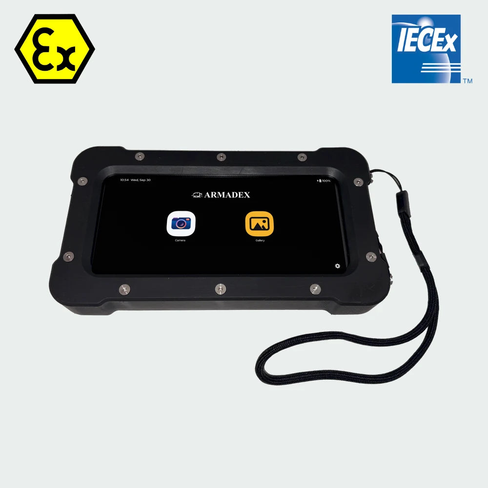 Rugged black Armadex TCO-60 ATEX/IECEx Zone 2/22 Hazardous Area Inspection Camera with a touch screen displaying camera and gallery app icons, equipped with a wrist strap.